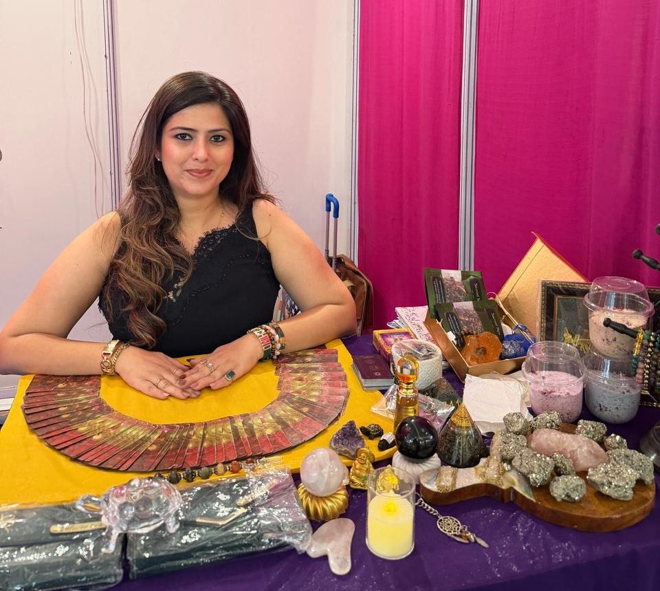 Komal Mehra at her stall with her tarot cards and crystals.